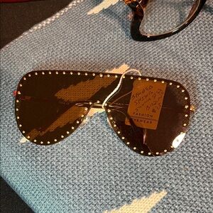 brown studdec and Gold Sunglasses